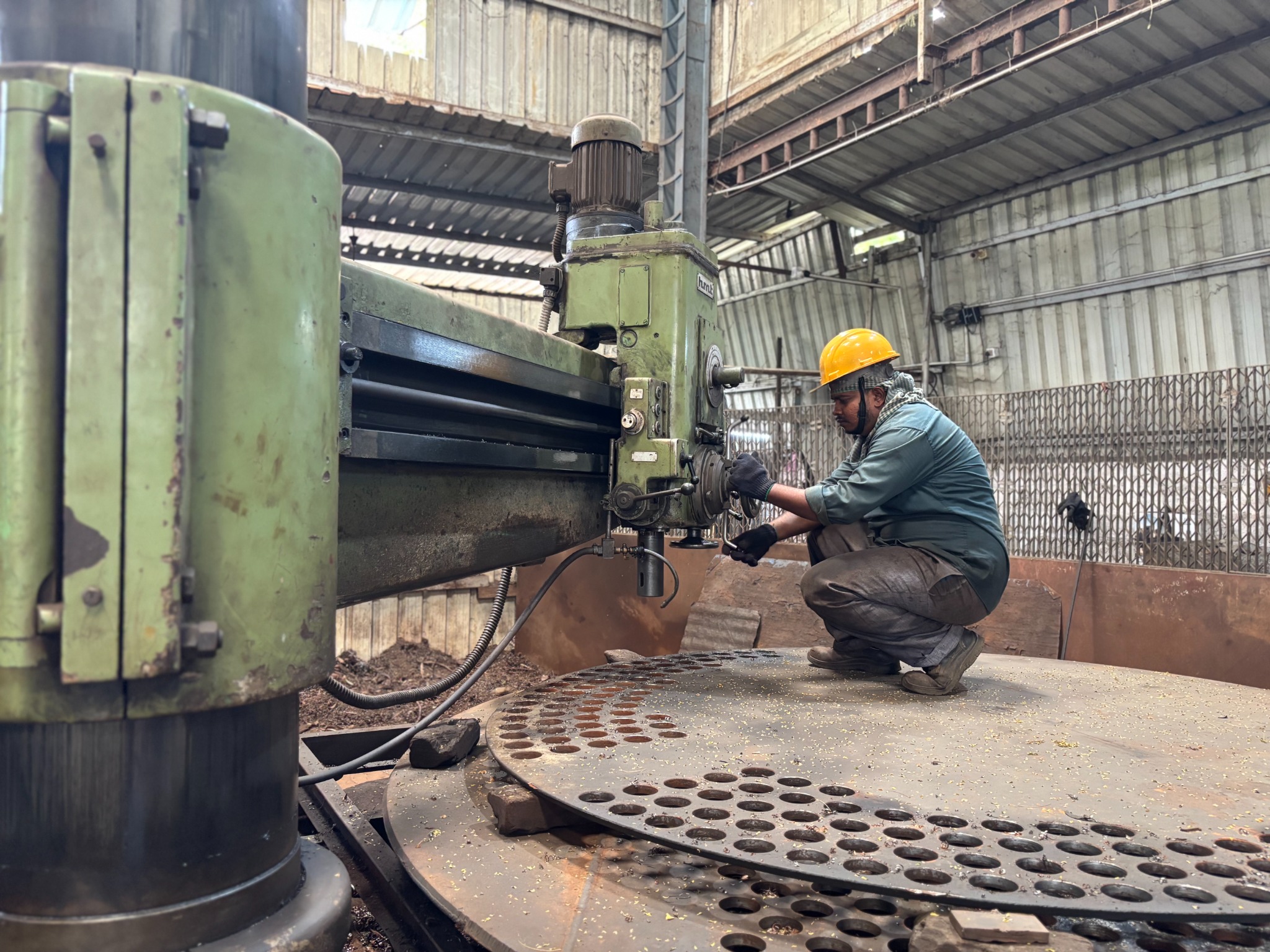 Operator working on heavy machining setup
