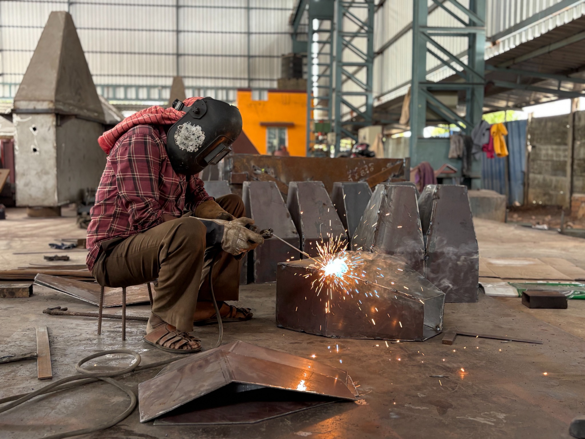 Welder fabricating sheet-metal component